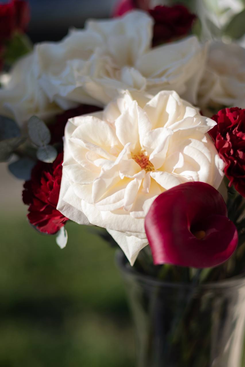 Floral arrangement — handcrafted with fresh seasonal blooms